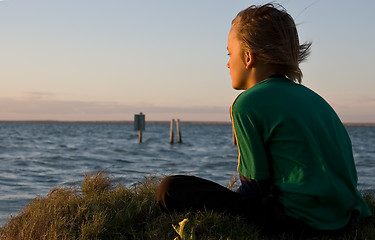 Image showing boy looking over lake