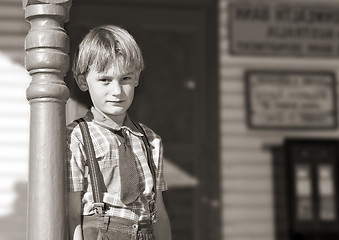 Image showing boy in front of shop