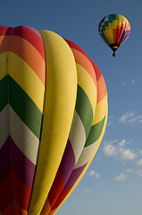 Image showing Hot air balloons launching against a blue sky