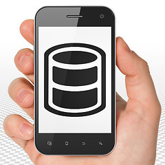 Image showing Programming concept: Hand Holding Smartphone with Database on display