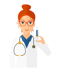 Image showing Doctor holding syringe.