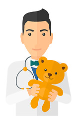 Image showing Pediatrician holding teddy bear.