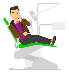 Image showing Man suffering in dental chair.