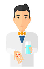 Image showing Pharmacist giving pills.