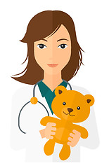 Image showing Pediatrician holding teddy bear.