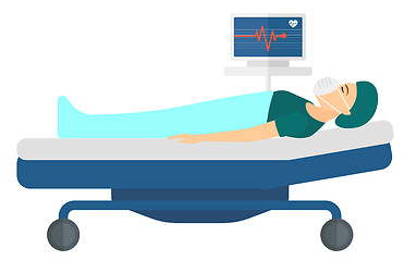 Image showing Patient lying in bed with heart monitor.