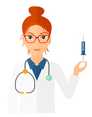 Image showing Doctor holding syringe.