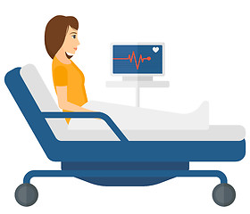 Image showing Patient lying in bed with heart monitor.