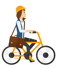 Image showing Woman cycling to work.