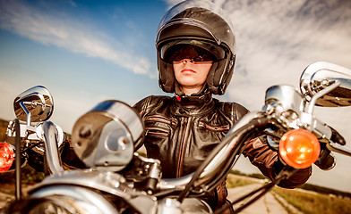 Image showing Biker girl on a motorcycle