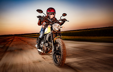 Image showing Biker girl on a motorcycle