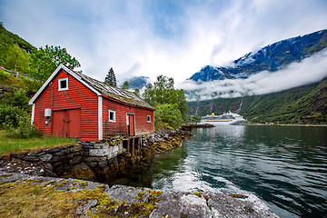 Image showing Norway landscape, the house on the shore of the fjord in the bac