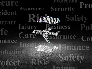 Image showing Insurance concept: Airplane And Palm in grunge dark room