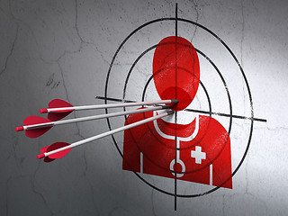 Image showing Medicine concept: arrows in Doctor target on wall background