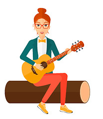 Image showing Woman playing guitar.