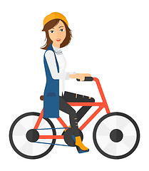 Image showing Woman riding bicycle.