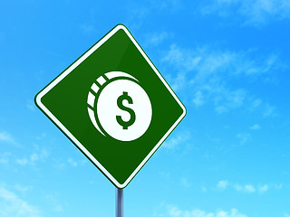 Image showing Currency concept: Dollar Coin on road sign background