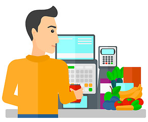 Image showing Cashier at supermarket checkout.