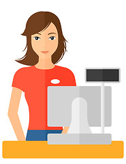 Image showing Saleslady standing at checkout.