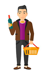 Image showing Customer with shopping basket and bottle of wine.