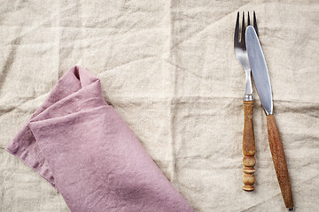 Image showing linen napkin background with fork and knife