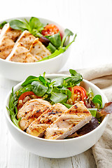 Image showing two bowls of salad with chicken