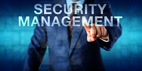 Image showing Manager Pressing SECURITY MANAGEMENT Onscreen