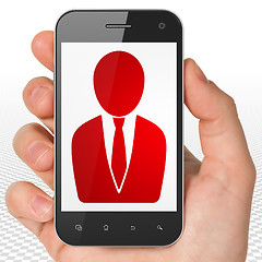 Image showing Law concept: Hand Holding Smartphone with Business Man on display