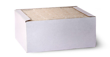 Image showing In front white sugar cubes in a box