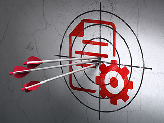 Image showing Programming concept: arrows in Gear target on wall background