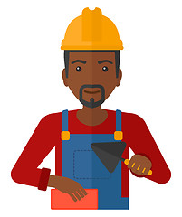 Image showing Bricklayer with spatula and brick.