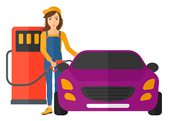 Image showing Woman filling up fuel into car.