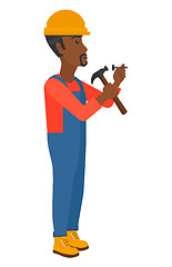 Image showing Man hammering nail.