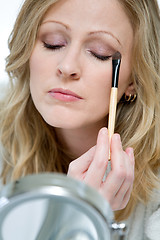 Image showing Applying eyeshadow