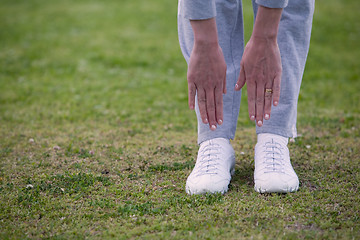 Image showing Trying to touch toes