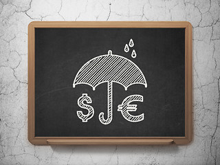 Image showing Protection concept: Money And Umbrella on chalkboard background