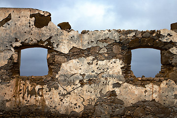 Image showing brown distorted  window in a broke paint anzarote spain