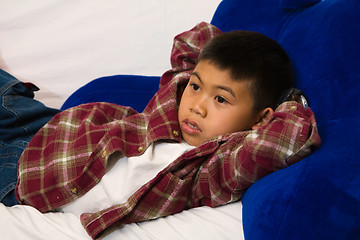 Image showing Sprawled out on the sofa