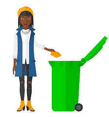 Image showing Woman throwing trash.