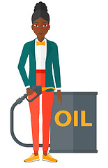 Image showing Woman with oil can and filling nozzle.