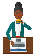 Image showing Woman eating hamburger. 