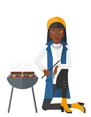 Image showing Woman preparing barbecue.