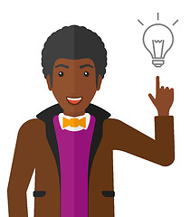 Image showing Man pointing at light bulb.