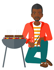 Image showing Man preparing barbecue.