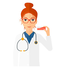 Image showing Pharmacist showing some medicine.