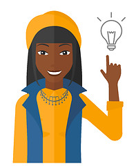 Image showing Woman pointing at light bulb.