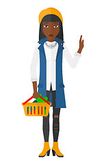 Image showing Woman holding supermarket basket.