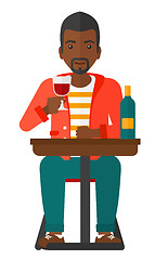 Image showing Man sitting at bar.