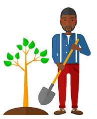 Image showing Man plants tree.