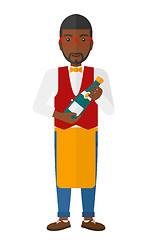 Image showing Waiter holding bottle of wine.
